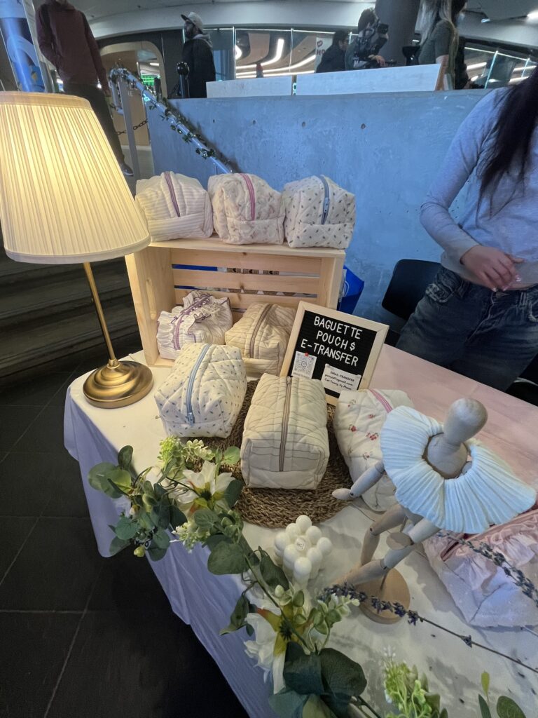 A table with pouches on display for sale. 