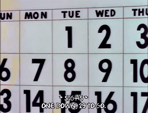 Homer Simpson marking an X on the first day of a calendar