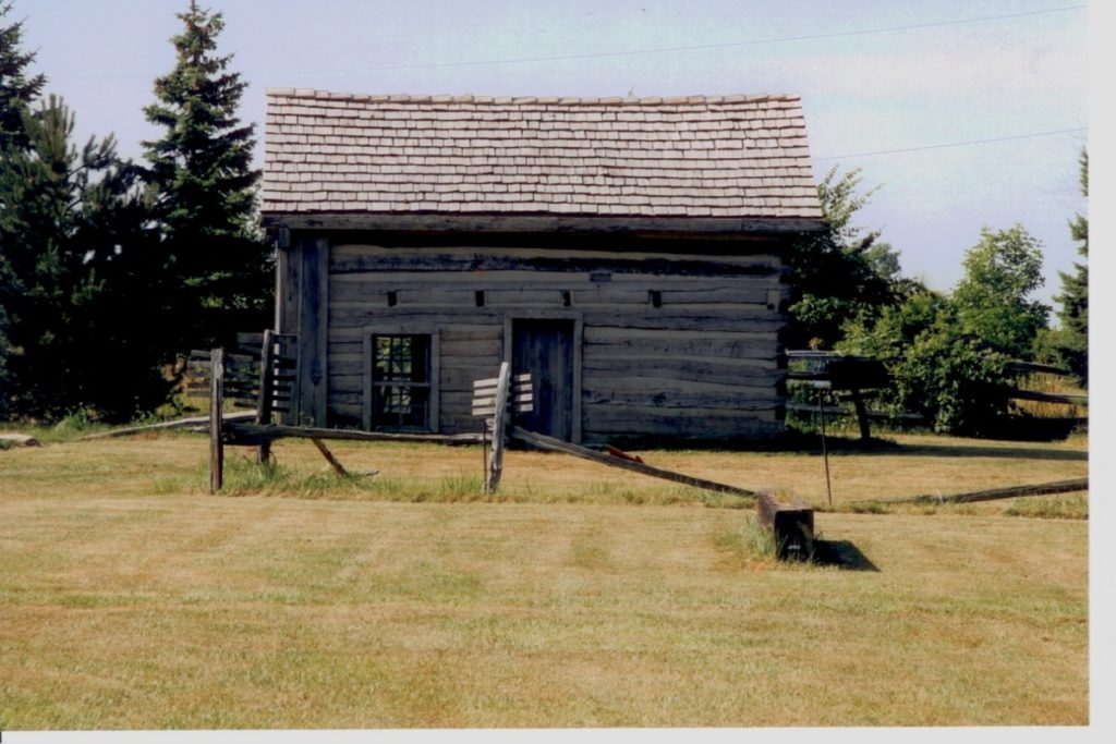 A picture of John Freeman 's log cabin that was used as a terminal.
