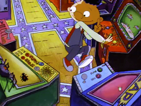 A cartoon character playing in an arcade.