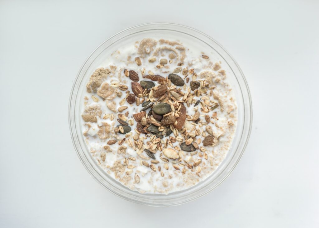 A bowl of overnight oats with almonds and nuts.