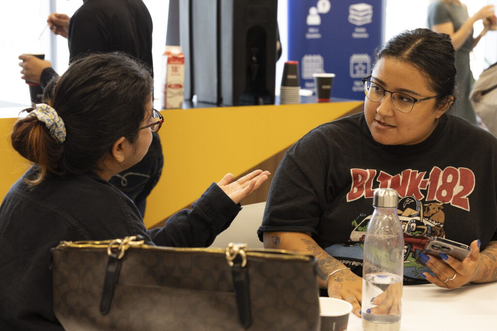 IGNITE Student Advocate Jessica in conversation with a student.