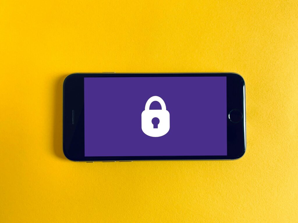 A phone with a locker on a purple background as its lock screen.