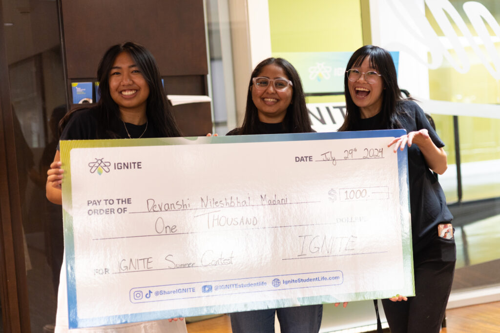 Devanshi Madani with IGNITE brand ambassadors holding the IGNITE Contest Prize