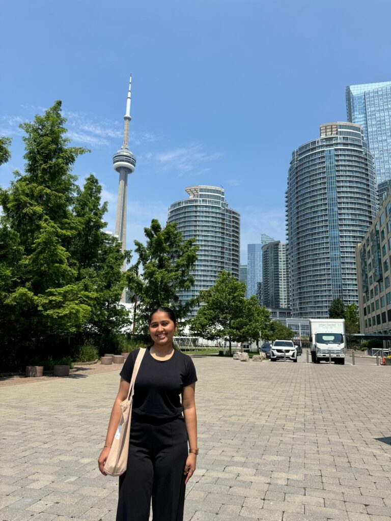 Devanshi Madani with the CN Tower in the background.