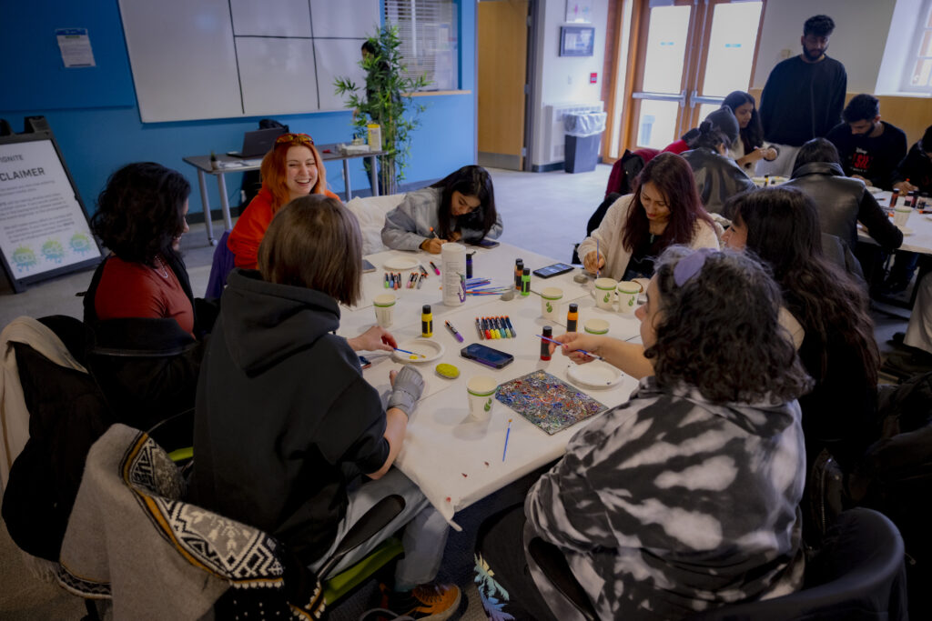 Group of creative students that are happily enjoying painting