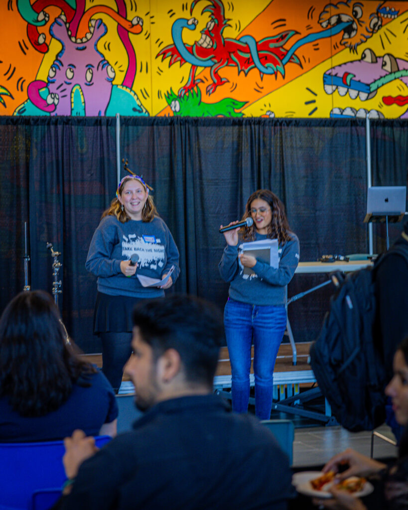 Take Back the Night event speakers talking about advocacy and student well-being