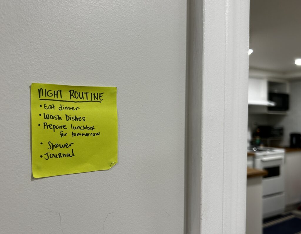 A sticky note on the wall with a list entitled, "night routine."