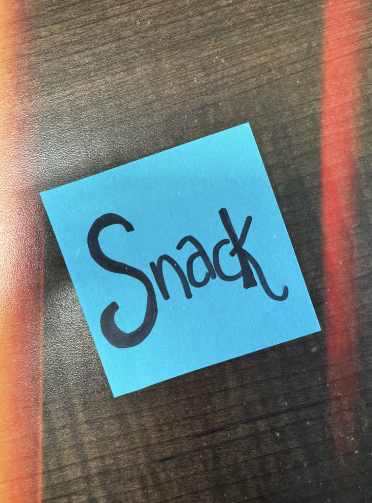 A paper with a written word "Snack".