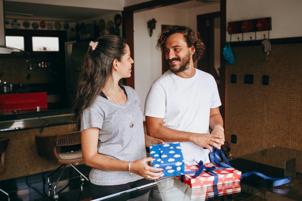 Couple opening Christmas gifts