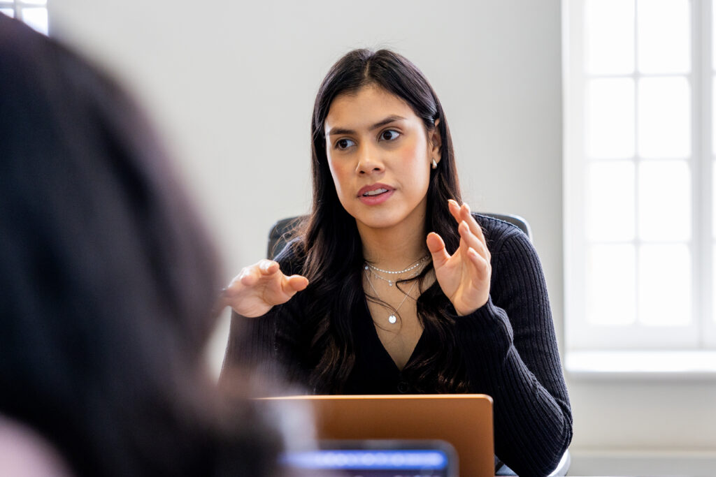 A woman is talking to another woman.