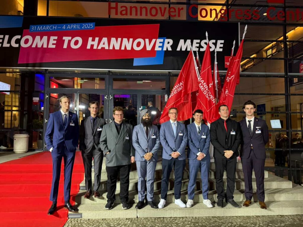 Cole Hunter standing beside his competitors and friends in front of the Congress Centre in Hannover Germany