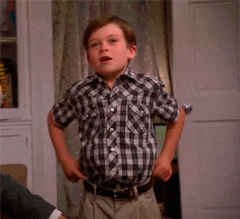 A boy posing and saying, "Fashion!"