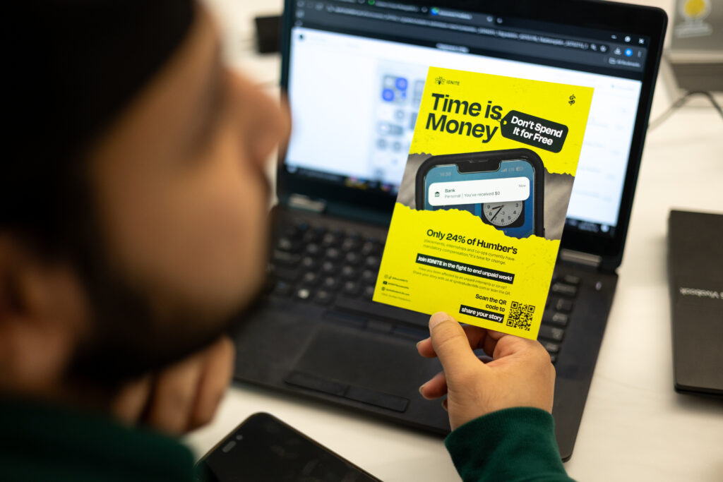 A person holding a time is money pamphlet. 