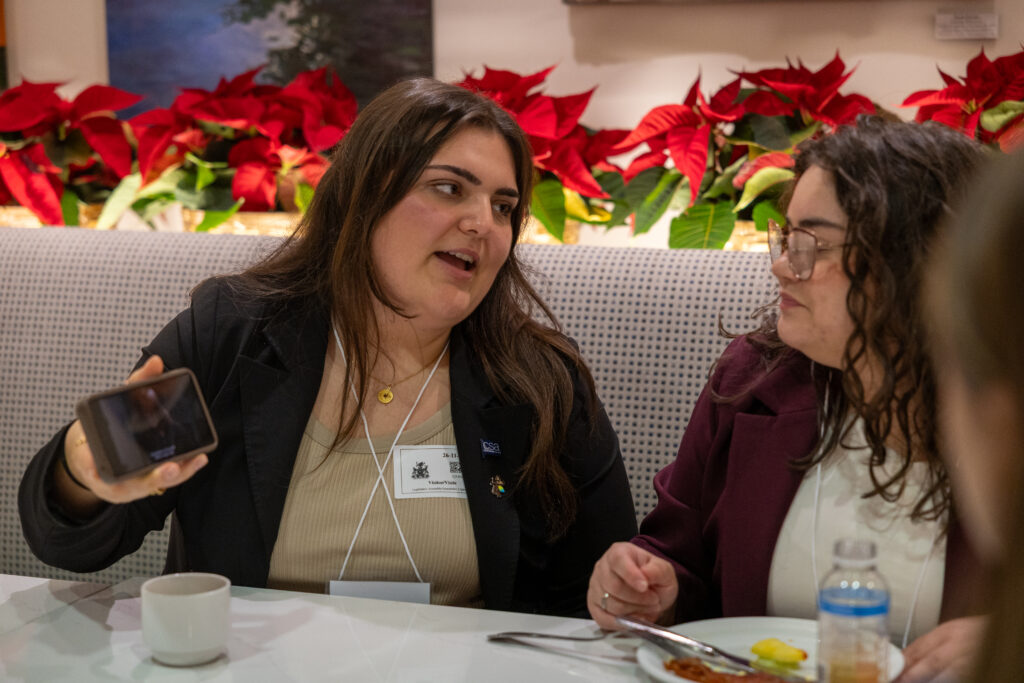 IGNITE Student Advocate Selena Ferreira is showing a campaign video to MPPs at Queen’s Park.