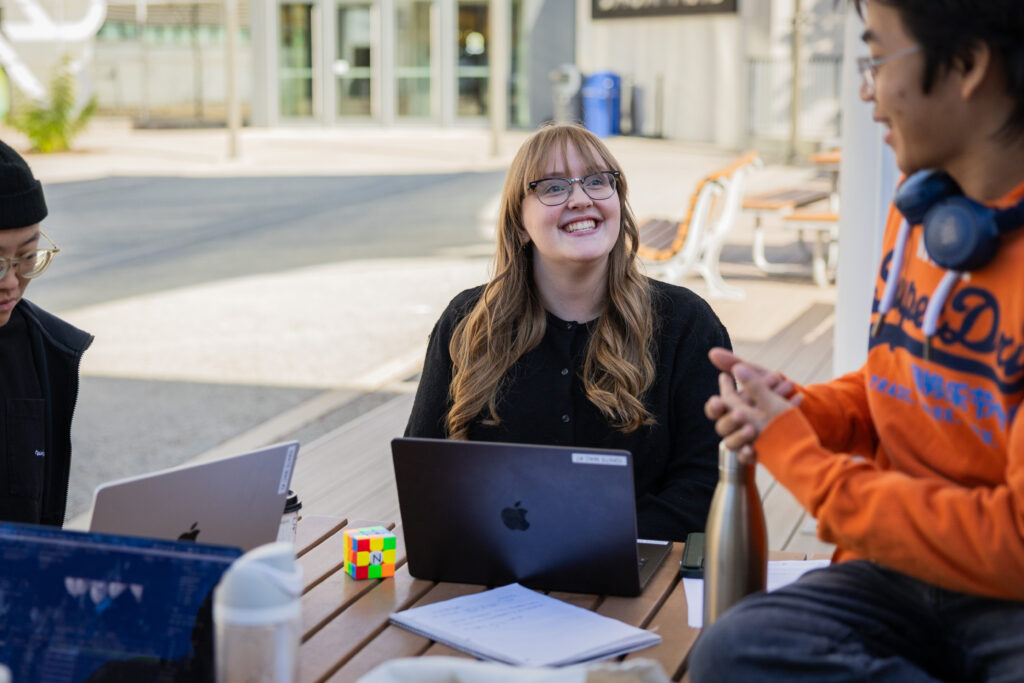 Emily Edwards listening and relating to students.