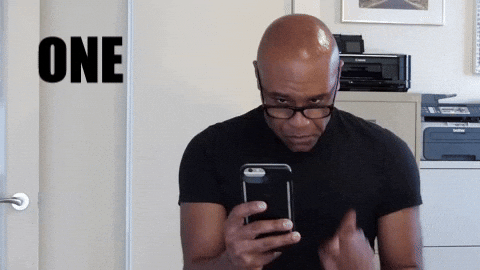 a man texting  with the caption reading 'one sec'