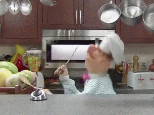 a muppet chef playing drums on melons