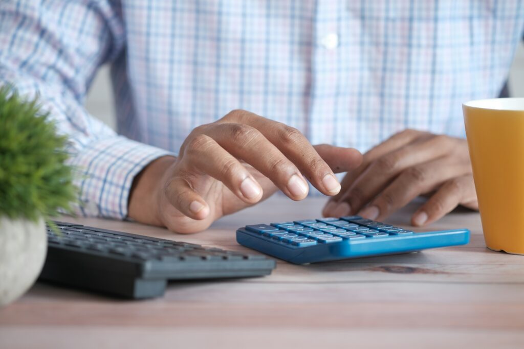 person using black computer keyboard photo