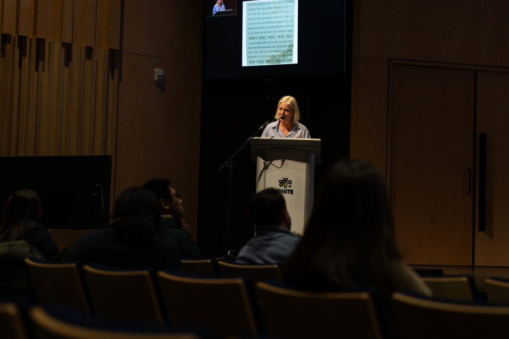 Catherine McKenna on stage talking about her Memoir