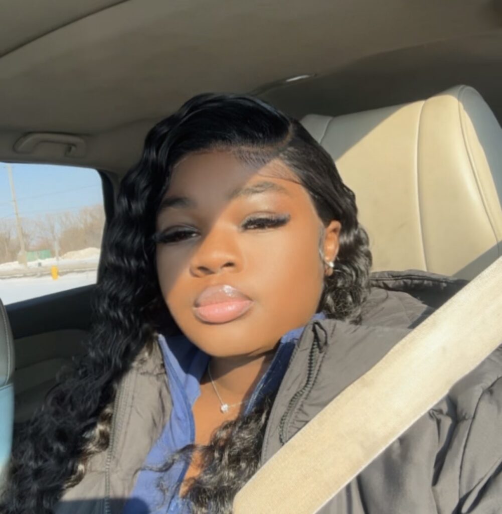 A selfie of Daneilia Smith in a car with her seatbelt on. 