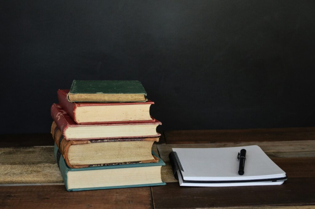 A stack of books on a desk