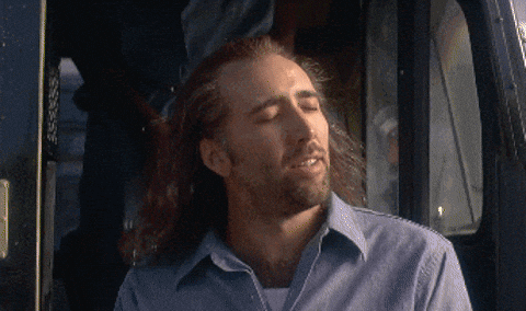 Nicholas Cage closing his eyes then a cut out of his head being transported through space.
