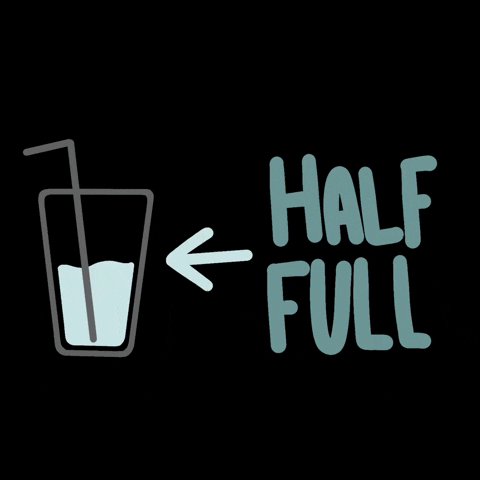 A drawing of a cup with liquid and a blinking sign saying 'Half Full' with an arrow pointing to the cup.