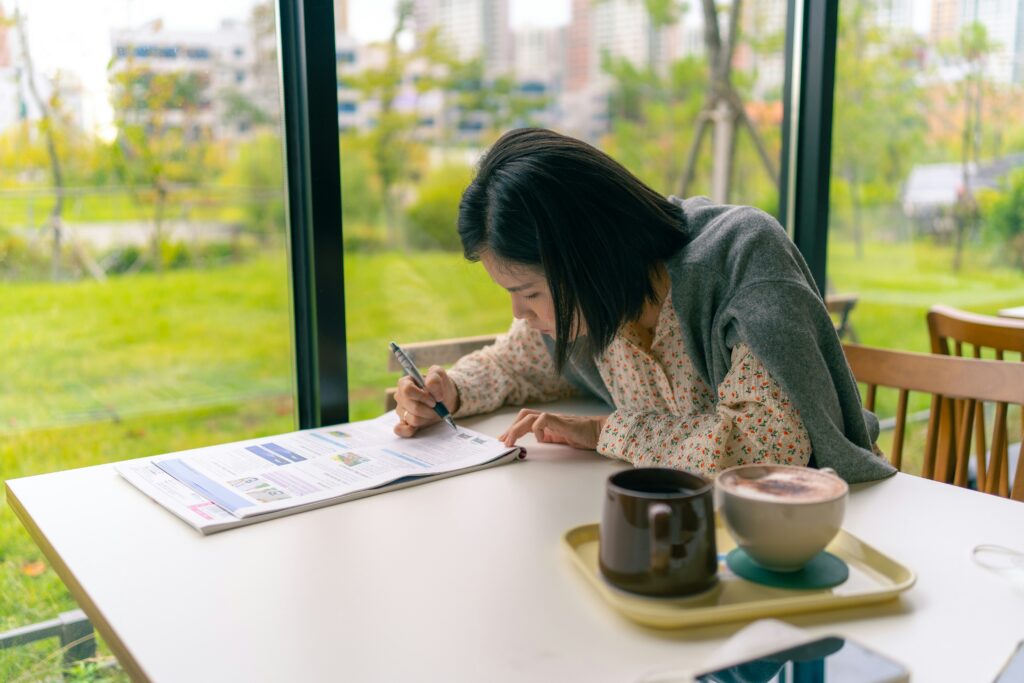 a woman studying in a café