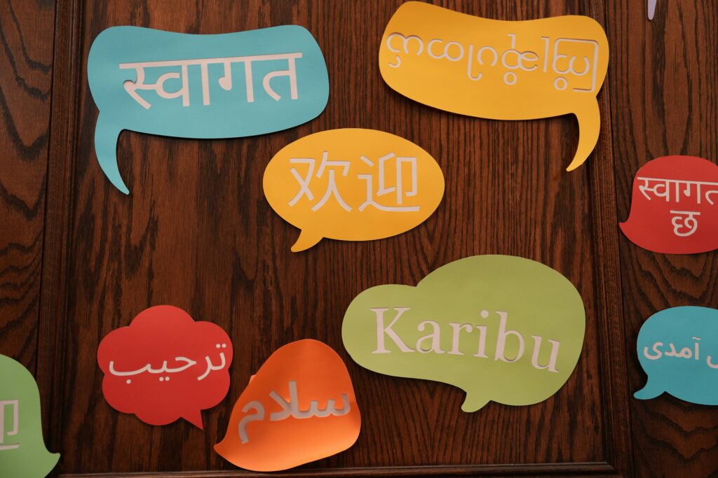 Thought bubble paper cutouts with words written in different languages