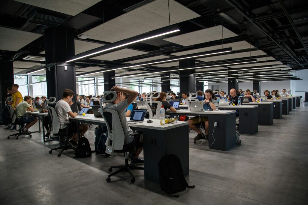 an office setting with people working at their desks