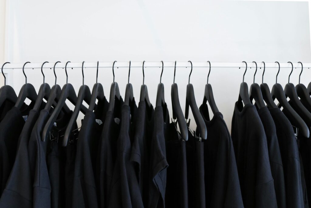 A clothing rack with only black clothing hung