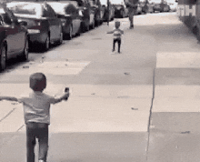Two babies running to each other and hugging