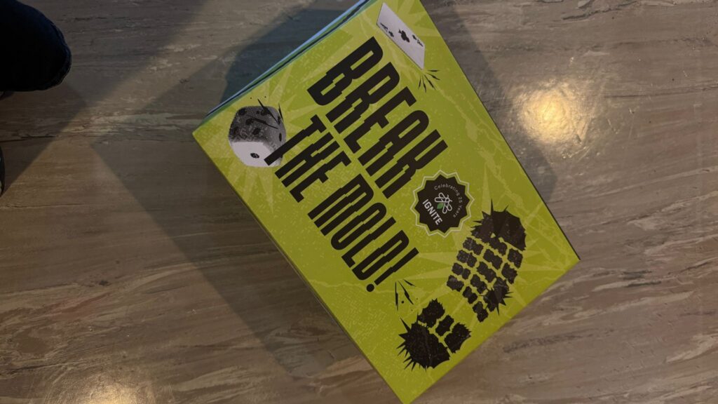 The shoe box reading, "Break the Mold!"